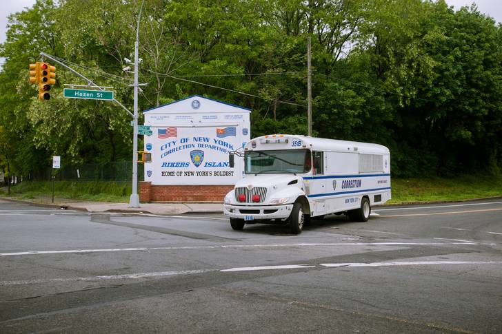 A prisoner bus at the entrance to Rikers Island jail in NYC.